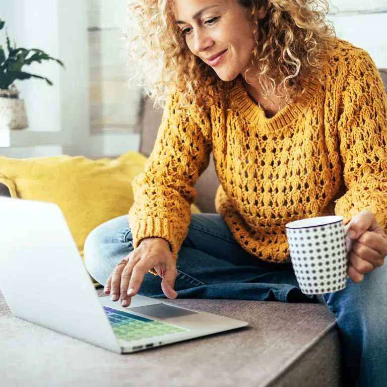 Woman reading reviews on laptop