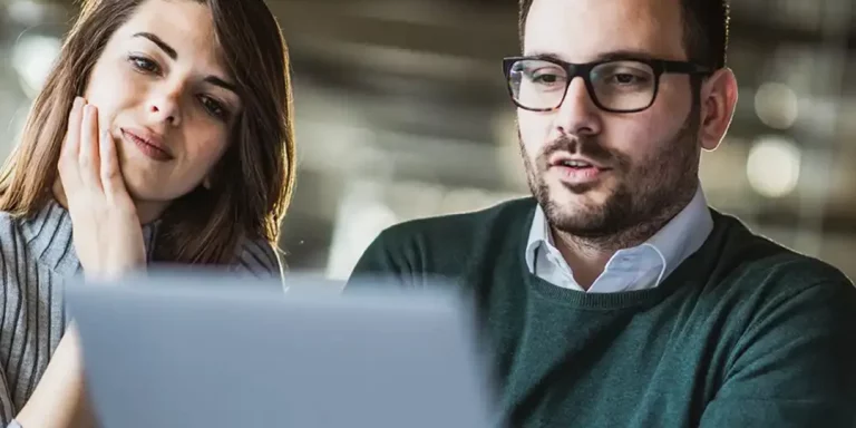 Man and woman using online print management