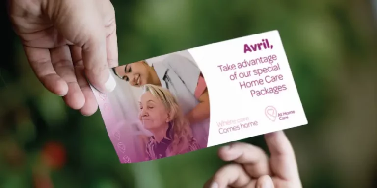 Person handing over a personalised marketing direct mailer